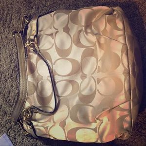 Beautiful coach gold bag. Leather handles.
